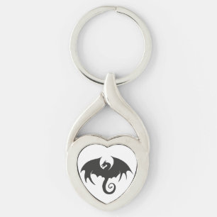 Teckning av en svart draksilhuett twisted heart silverfärgad nyckelring