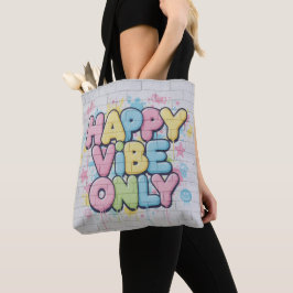 Tegel med färgrik text som säger “ Happy Vibe Only Tygkasse