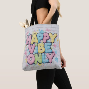 Tegel med färgrik text som säger “ Happy Vibe Only Tygkasse