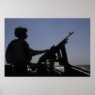 Tekniker som bemannar en maskingevär M240 i Irak Poster