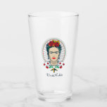 TEMPLATE GLASKOPP<br><div class="desc">This captivating design for a glass features a striking stylized portrait of iconic artist Frida Kahlo. Her distinctive features are highlighted, framed by a vibrant headpiece of red and yellow flowers and green foliage. She wears unique skull earrings and a decorative necklace-like motif with red blossoms and a small yellow...</div>