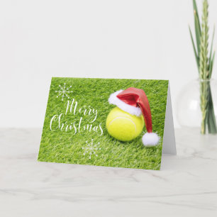 Tennis-jul med tennis boll och Santa hat Helgkort