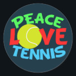 Tennis Kärlek Blue jul Runt Klistermärke<br><div class="desc">Jag kärlek spelar tennis. En söt tennisspelargåva med en gult tennis boll som O i Kärlek. Peace Kärlek Tennis skriven i grönt,  röd och blå.</div>
