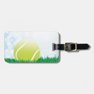 tennisboll på gräs bagagebricka