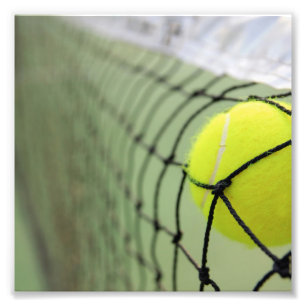 Tennisboll som netto slår fototryck