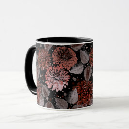 Terracotta-blommor med grått löv på svart mugg