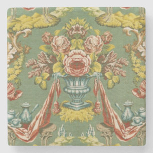 Textil med ett upprepande blom- motiv underlägg sten