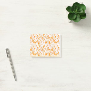 Textil mönster med en levande orange och ett sunt post-it block