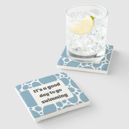 Textmall och blå mönster stenunderlägg