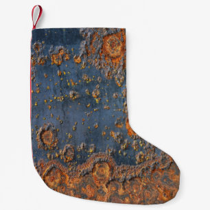 Texturerad bakgrund för metall. liten julstrumpa