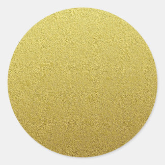 Texturerat guldfärgsutseende runt klistermärke