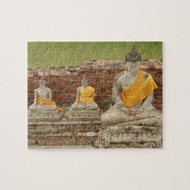 Thailand, Ayutthaya. Statyer av sittande buddor Pussel (Horisontell)