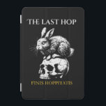 THE LAST HOP iPad MINI SKYDD<br><div class="desc">"THE LAST HOP" T-Shirt merges timeless memento mori symbolism with a twisted twist. This unisex black tee showcases a high-contrast, hand-drawn design of a rabbit claiming its throne atop a cracked skull – a metaphor for fate’s cruel humor. The Latin tagline "Finis Hoppitatis" (crafted in Blackletter font) adds an air...</div>