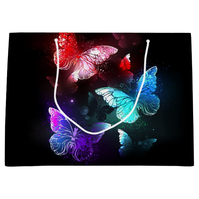 Three Glowing Butterflies on night background (Framsidan)