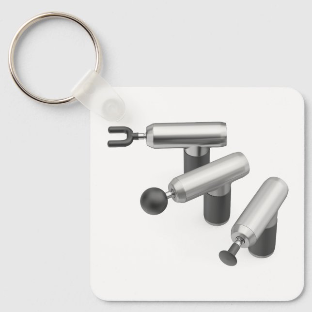 Three massage guns with different massage heads nyckelring (Framsida)