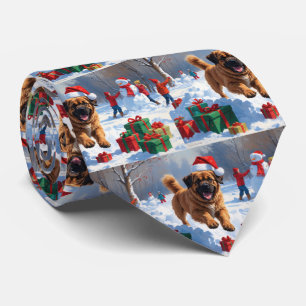 Tibetansk Mastiff springer i snö med julhatt Slips