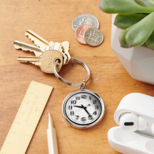 Tiden flyter. rund silverfärgad nyckelring