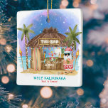 Tiki Beach Pub Moonlight Santa Tropical jul Julgransprydnad Keramik<br><div class="desc">Den tropiska julprydnaden har en semester på Tiki pub på stranden under måne och stjärnor med handflatan träd, ljus och Hawaiianska "Aloha" och "Mele Kalikimaka" hälsning. Tropiska cocktails, ananas, hibiscus och handflatan löv, en ytskiva och en papegoja i en pirat som dekorerar pub. Anpassa den för en roligt, en vänlig...</div>
