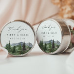 Timberline | Watercolor Mountain Wedding Thank You Runt Klistermärke<br><div class="desc">Bring a personalized touch to your wedding favors with this round thank you sticker from the Timberline collection by Redwood & Vine Design Co. The design features a serene watercolor mountain scene with lush evergreens and elegant script. Customize with your names and wedding date to coordinate with your rustic, winter,...</div>