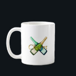 Toasting with a bottle kaffemugg<br><div class="desc">"Toasting with a bottle" features a striking design of crossed champagne bottles and the word "Cheers, " creating a celebratory mood. It's the perfect item to add color to special moments such as parties,  anniversaries,  and the New Year holidays. It creates a glamorous and fun atmosphere.</div>
