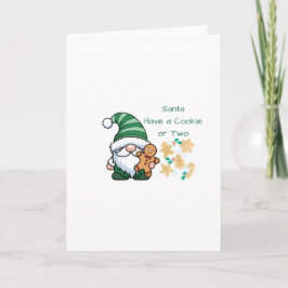 Tomte har en kaka eller två på ett julkort kort