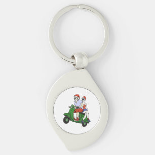 Tomten och Mrs Claus rider en skoter Swirl Silverfärgad Nyckelring