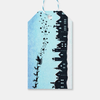 Tomten som flyger över hus jultomten MÄRKRE Presentetikett