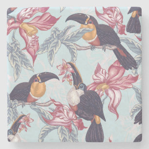 Toucans med exotiska blommor underlägg sten