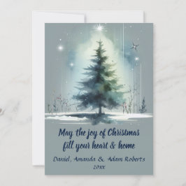 Träd i akvarellstil mot medelblå bakgrund julkort