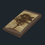 Träd Silhouette på Bronze Background<br><div class="desc">En brons bakgrund fungerar som skådeplats för en silhuett träd med grenar som sveper in bron. Du känner dig nästan som om du kunde vila dig mot träd,  sitta på marken och ta en lång tupplur.</div>