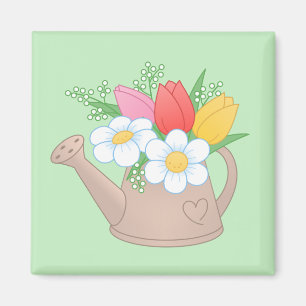 Trädgårdsvattningskanna med blommor på grönt magnet