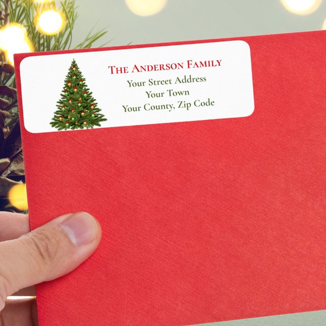 Traditionell grön julgran röda band namn returadress etikett (Skapare uppladdad)