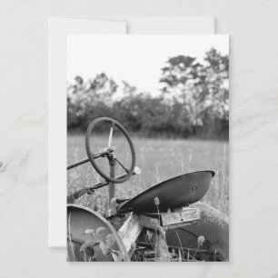 Traktor i högt gräs kort