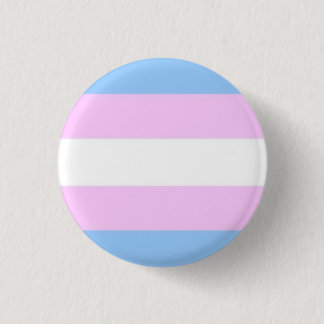 Transgenderflagga knäppas knapp