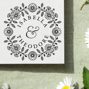 Trästämpel med blomsterkrans och parnamn stämpel