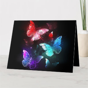 Tre Glowing Butterflies på nattbakgrund Kort