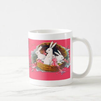 Tre kaniner i en basketmugg kaffemugg