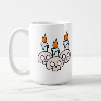 Tre kranier med brinnande ljus kaffemugg
