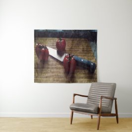 Tre röda tomater på en choppboard