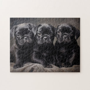 Tre svarta hundvalpar pussel