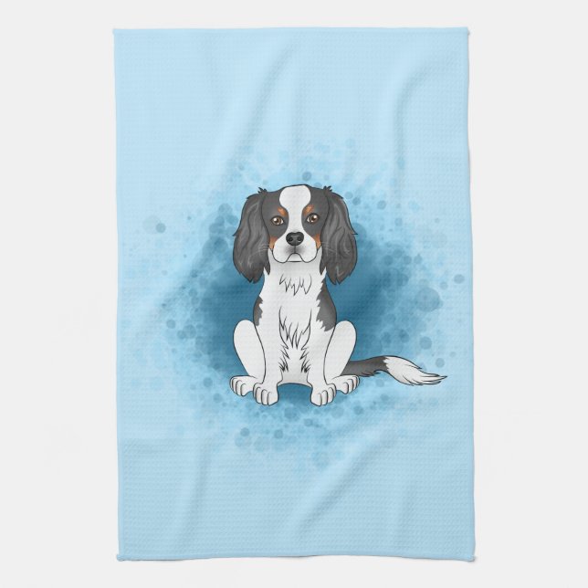 Trefärgad Cavalier King Charles Spaniel Hund På Bl Kökshandduk (Vertikal)