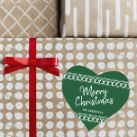 Trendig Reindeer Typography God jul Hjärtformat Klistermärke<br><div class="desc">Den ge gåvan förenklas denna julhelg med dessa unika och moderna julklistermärken. Utformningen har en fenomenal grönt med det vita typografiska skriptet "God jul" och motsvarande renkant. Lägg enkelt till anpassningsbarnas ordalydelse i dessa helgdag genom att använda avsnittet "Redigera den här designmallen" eller klicka på knappen "Anpassa" för att få...</div>