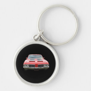 Trevlig orangish eller röd Oldsmobile Cutlass Rund Silverfärgad Nyckelring
