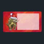 Triceratops jul på Red Fraktsedel<br><div class="desc">Juldesignen i Parad från djurparken i Festive Triceratops ger vår roligt illustration av en triceratops som bär en röd julhatt och som står i ett snölandskap mot en blå stjärnnatt. Vår ursprungliga dinosaurikonst målades av vår begåvade barnillustrator Traci Van Wagoner. På många av våra helgdag och tillbehör till roligten hittar...</div>
