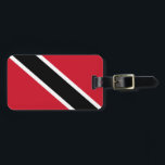 Trinidad och Tobago Flagga Bagagebricka<br><div class="desc">Trinidad och Tobago-flagga är ett fimbriserat diagonalt färgtriband. Den använda färgen i flagga är röd,  vit,  svart. Andelen Trinidad och Tobago flagga är 3:5. Trinidad och Tobagos Flagga antogs 1962.</div>