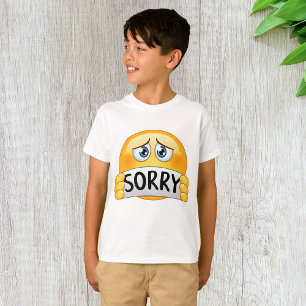 Trist ledsen Emoji-ansikte som håller ett beklagan T Shirt