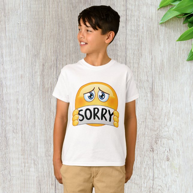 Trist ledsen Emoji-ansikte som håller ett beklagan T Shirt (Skapare uppladdad)