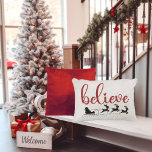 Tro Santa med Sleigh och Reindeer Prydnadskudde<br><div class="desc">Pillow har ord som "tror" på ett rött skript typsnitt och inkluderar tomten med sitt slift och renar i svart silhuett och guld-vitt gixdamm under.</div>