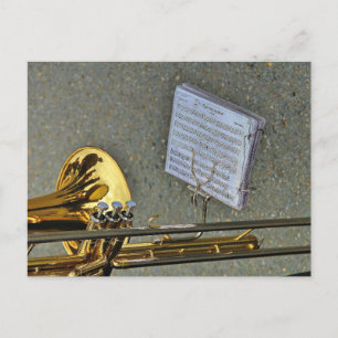 Trombone-musikinstrument med notation vykort