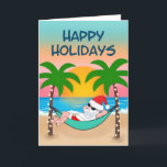 Tropical Beach Santa Hammock Handflatan Träd Helgkort<br><div class="desc">Julkortet för tropisk och kustnära tema har tomtslaxning i en hammock på stranden, njuter av havets vinkarare och en färgstark solnedgång och handflatan träd som är ute i stranden ljus. Cover hälsning säger "Glad helg" i marinblått. Inuti hälsning och namn kan man vara personlig (visas med "varmaste Önskemål" men skulle...</div>